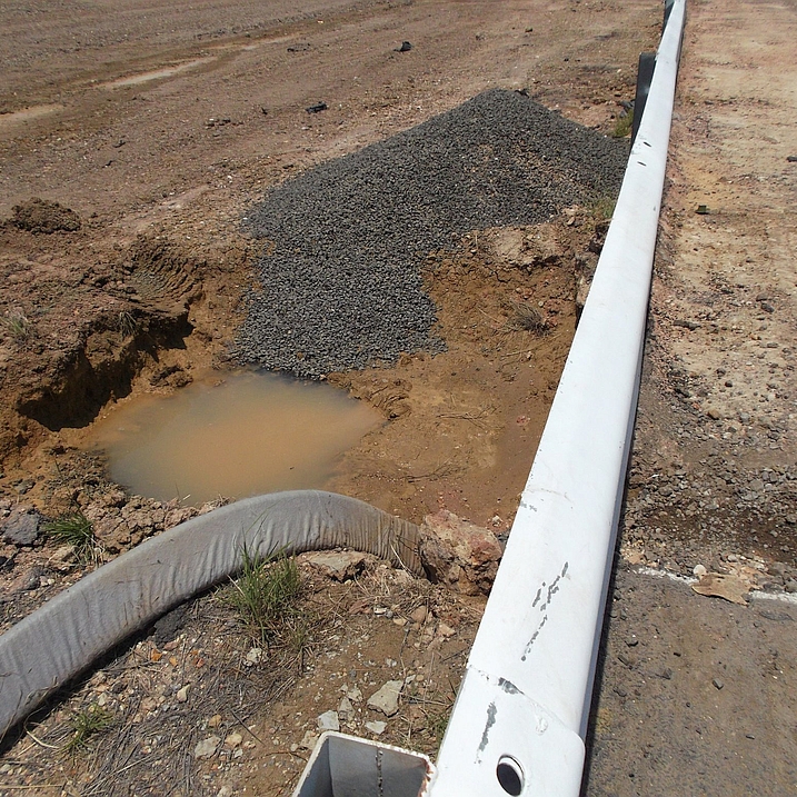 This drain is under the 60ft mark. Its purpose is to drain any water which may get under the track surface. As you can see the drain is already working well shown by the water on the southern side of the armco barrier. Nicely done guys This drain is under the 60ft mark. Its purpose is to drain any water which may get under the track surface. As you can see the drain is already working well shown by the water on the southern side of the armco barrier. Nicely done guys.